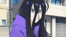 a girl with long black hair has a purple hoodie on