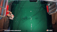 an advertisement for american ninja warrior shows a man swimming in a pool