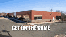 a brick building with the words get on the game written on it