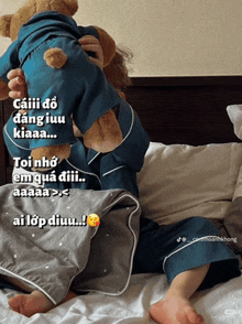 a person holding a teddy bear in their arms with a caption that says " ai lop diuu "