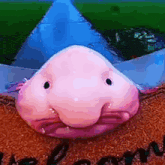 a pink fish with a large nose is sitting on a welcome mat .