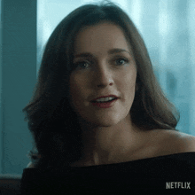 a close up of a woman 's face with the word netflix on the bottom right