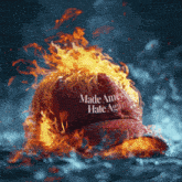 a red hat that says made america hate again is on fire