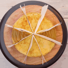 a tortilla that has been cut into slices on a wooden cutting board