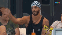 a man wearing a headband that says open on it