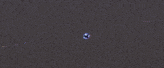 a blue and white robot is flying through the air .