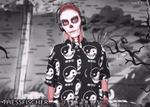 a woman with skulls painted on her face is wearing headphones and a shirt that says thessfischer