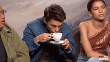 Intense Sipping Tom Holland GIF - Intense Sipping Tom Holland Popbuzz GIFs