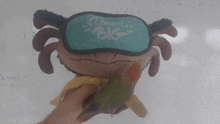 a stuffed animal with a sleep mask that says " dream big "