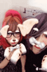 two girls are posing for a picture with their faces painted like dogs .