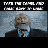 a man with a beard in a suit and tie with the words take the camel and come back to home below him
