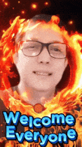 a man wearing glasses is surrounded by fire and the words welcome everyone