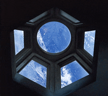 looking up at the sky through a window in a building
