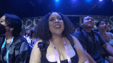 a woman with a lanyard around her neck that says ' i love you '