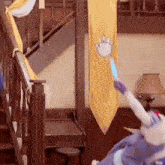 a person in a costume is standing in front of a yellow banner in a room .