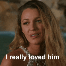 a woman wearing a pearl necklace with the words i really loved him below her