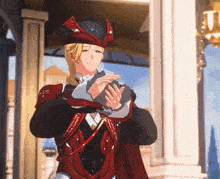 a man in a red and black outfit is holding a cat in his arms