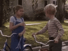 a boy and a girl shake hands with the words encantado em te conhecer