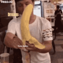 a man is holding a banana in front of his face with the words dream toxic guilds on it