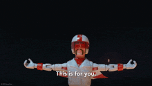 a toy story character says " this is for you " in front of fireworks