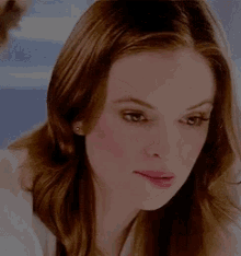 a close up of a woman 's face with her eyes closed