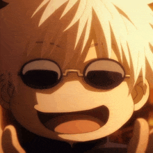 a close up of a person wearing sunglasses and making a face