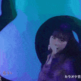 a woman singing into a microphone with the words hot spice written on the bottom