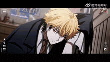 a man with yellow hair is laying down in front of a sign that says ' a.i.e.f. '