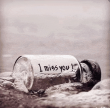 a bottle that says i miss you on it