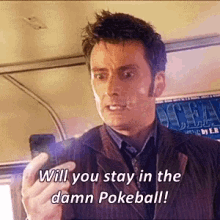 a man in a suit and tie is holding a cell phone and saying " will you stay in the damn pokeball " .