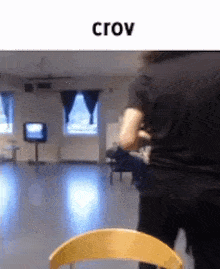 a blurry picture of a person standing in a room with the word crow on the top