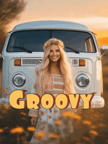 a woman stands in front of a white van that says groovy on the front