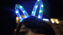 a close up of a woman wearing bunny ears