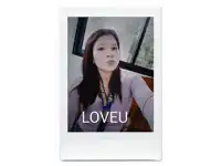 a woman taking a selfie with a doveu shirt on