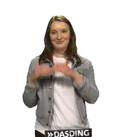 a woman wearing a denim jacket and a white shirt has the word dasding on her shirt