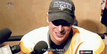 a man wearing a hat that says penguins hockey