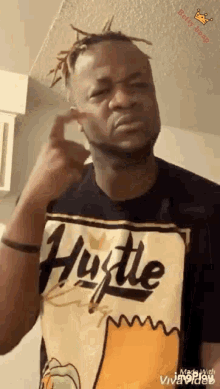 a man wearing a shirt that says hustle on it