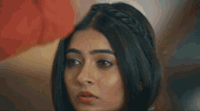 a close up of a woman 's face with tears running down her face .