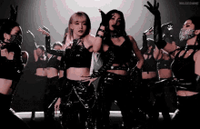 a group of women are dancing in a dark room and the words musemine are on the bottom