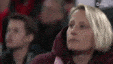a woman is watching a game on tnt sports