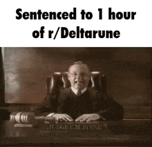 a judge is sitting at a desk in a courtroom holding a gavel and a hammer .
