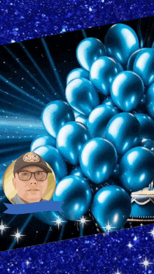 a picture of a man surrounded by blue balloons with a speech bubble