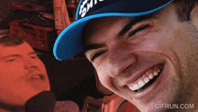 a man wearing a blue hat with the word gm on it