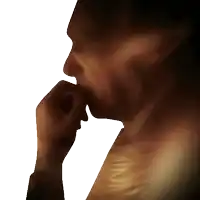 a close up of a man 's face with his hand on his mouth