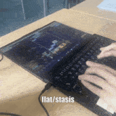 a person is typing on a laptop with the words flat / stasis on the bottom
