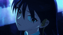 a close up of a person 's face with blue hair