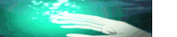 a hand is reaching out towards a green light .