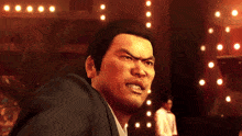 a man in a suit is making a funny face in front of a crowd