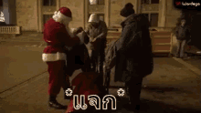 a group of people dressed as santa claus are standing on a street .