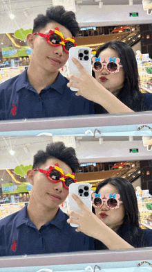 a man and a woman wearing sunglasses are taking a picture of themselves in the mirror